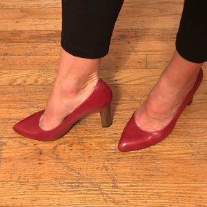 Kate Spade red pump with block wood heel.